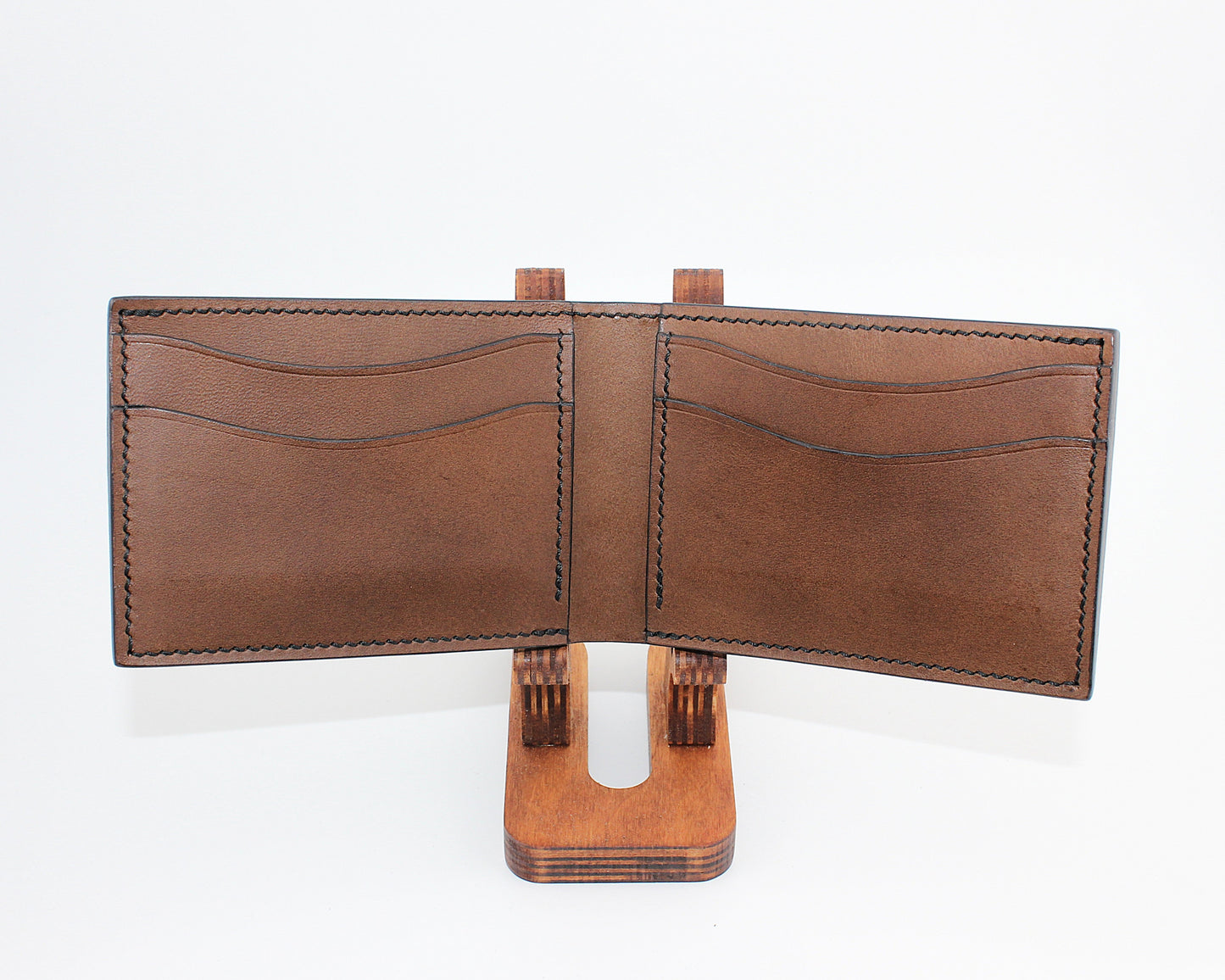 Brown leather wallet on a white background