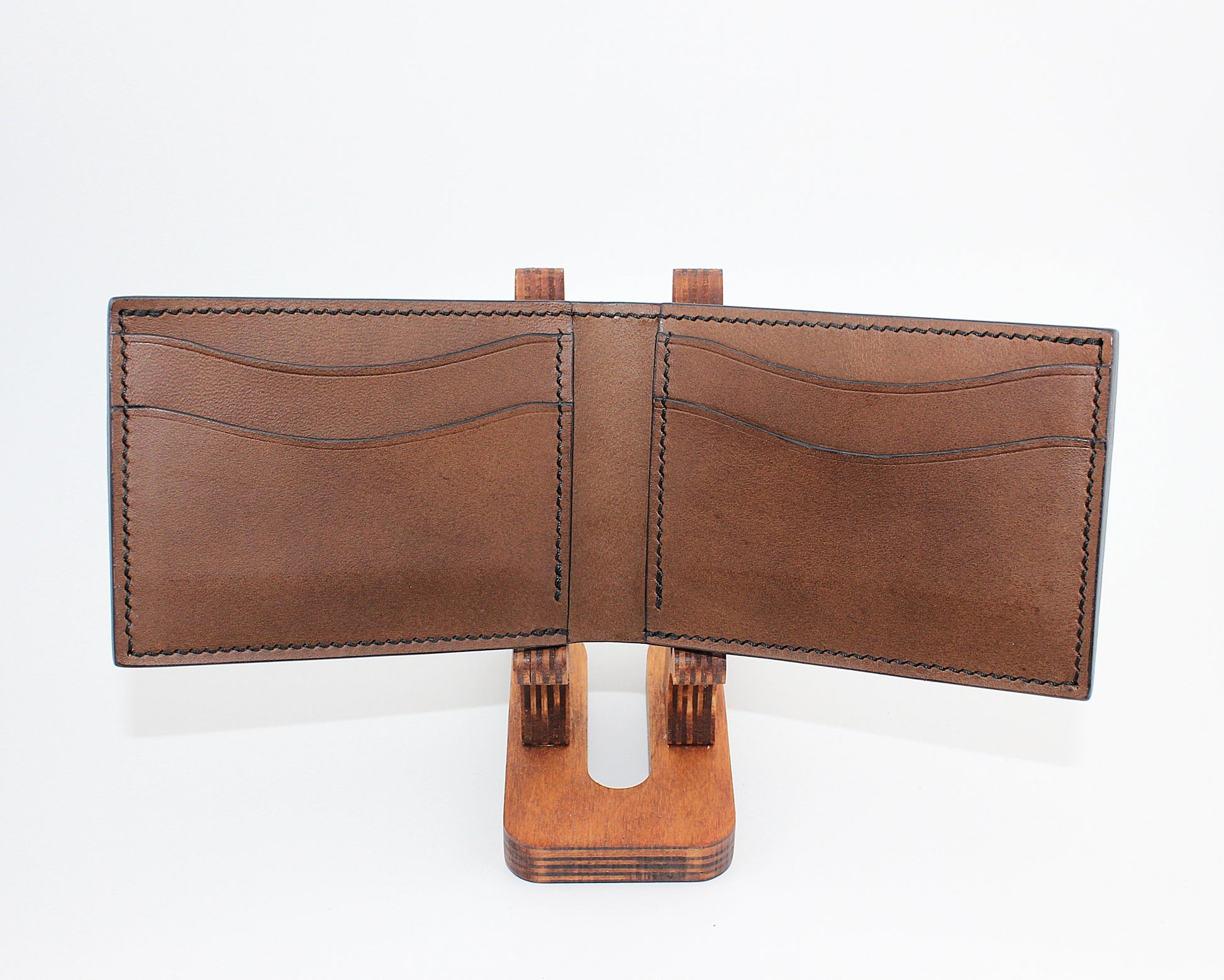Brown leather wallet on a white background