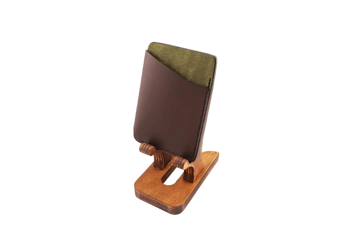 Brown leather cardholder with green accent on a white background