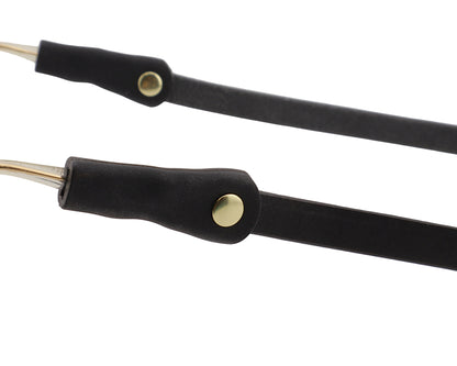 Black leather lanyard with gold metal ends on a light gray background
